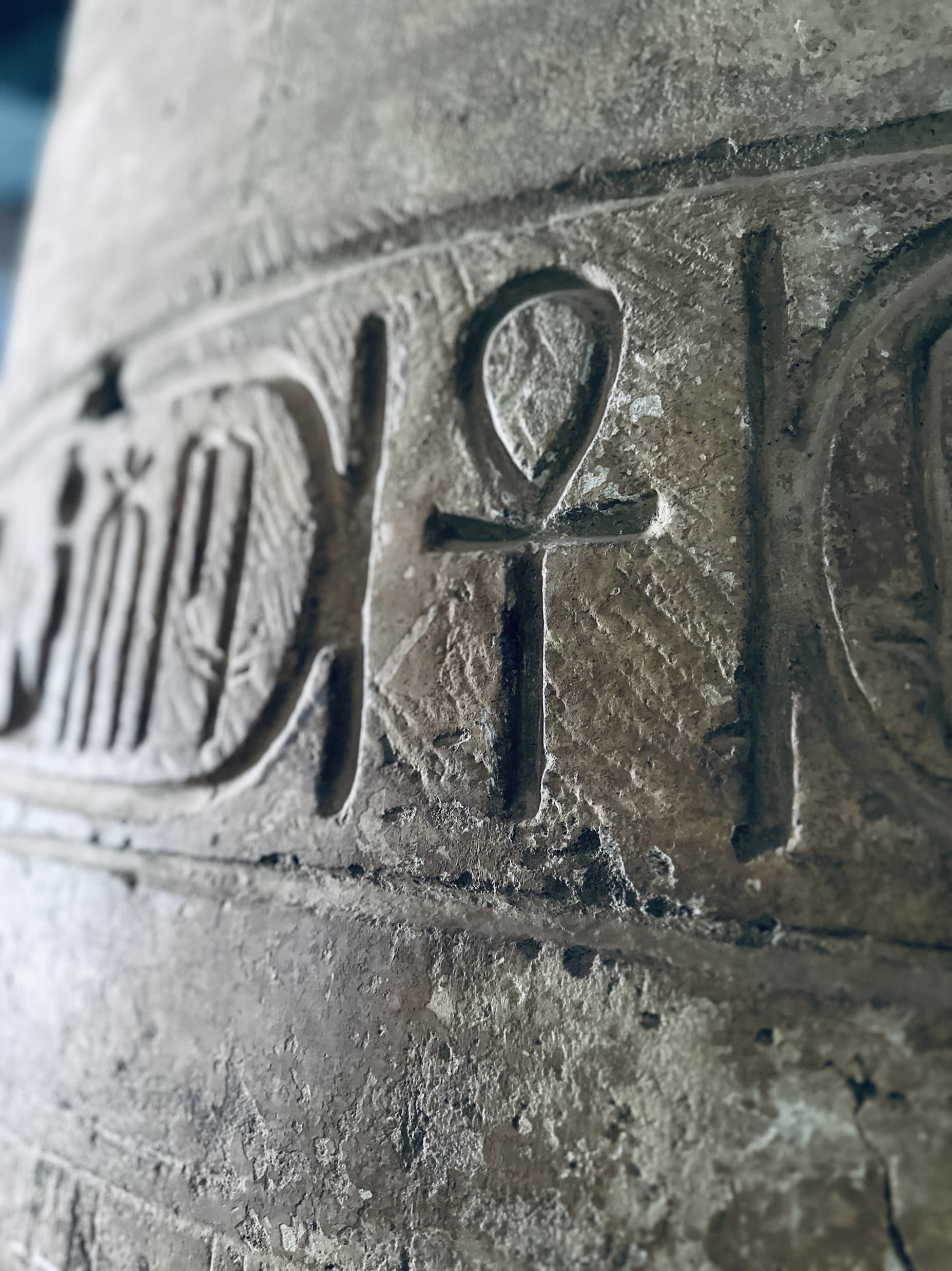 A close-up of an Ankh — the looped cross of life — carved into a temple wall