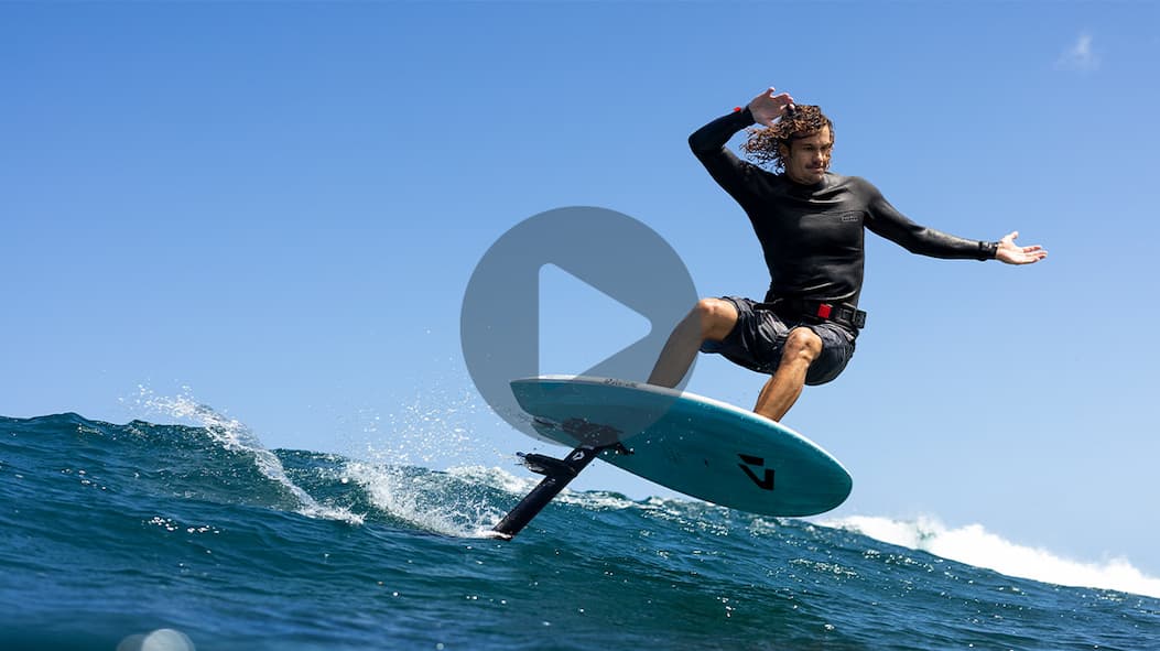 Leo Etienne carving on a wave with the Foil Assist