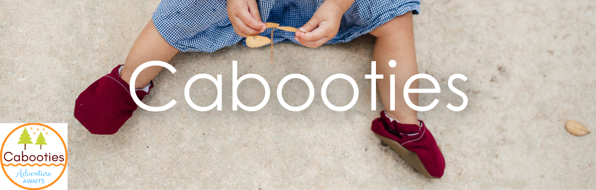 Cabooties logo and text on image of child wearing Burgundy Denim Cabooties handmade, washable, vegan baby shoes, available at cabooties.com