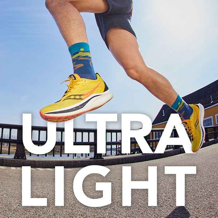 Shop Ultralight Run Socks - a runner wearing Ridge Runner socks in the air, midstride