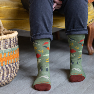 Shop Socks, provide meals - feet wearing green socks with vegetables