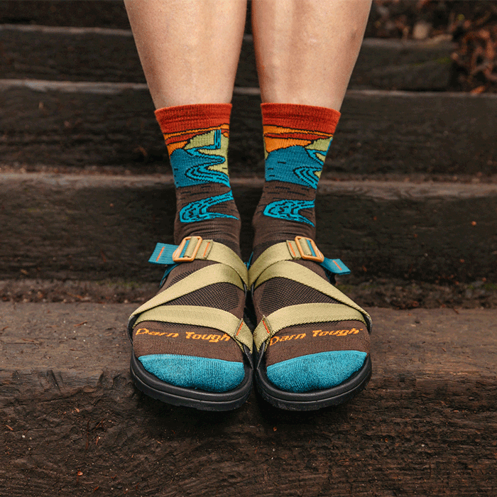 Read the blog - a hiker wearing colorful socks and strappy sandals, flanked by emoji faces