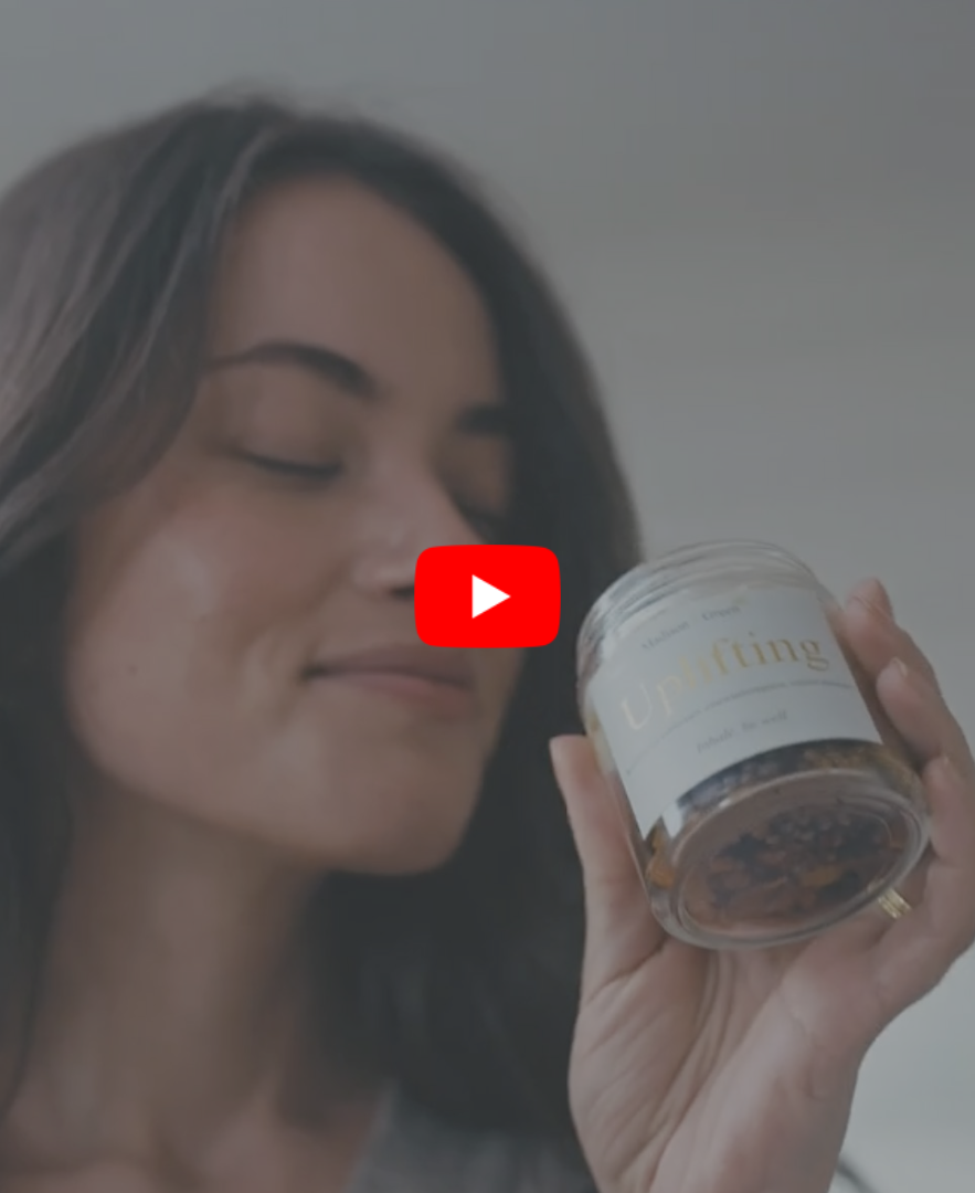 short tik tok video of a woman smelling uplifting scent