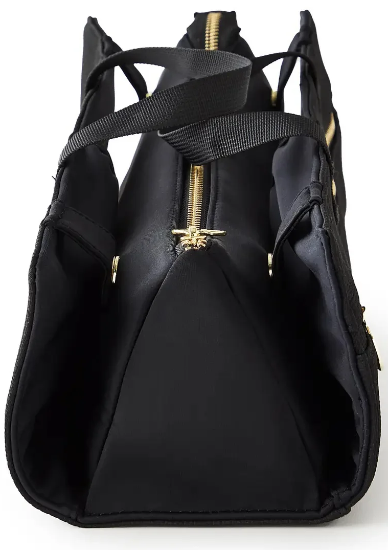 Structured black travel organizer bag with gold zipper detailing, side storage pockets, and carrying handles, shown against a white background.