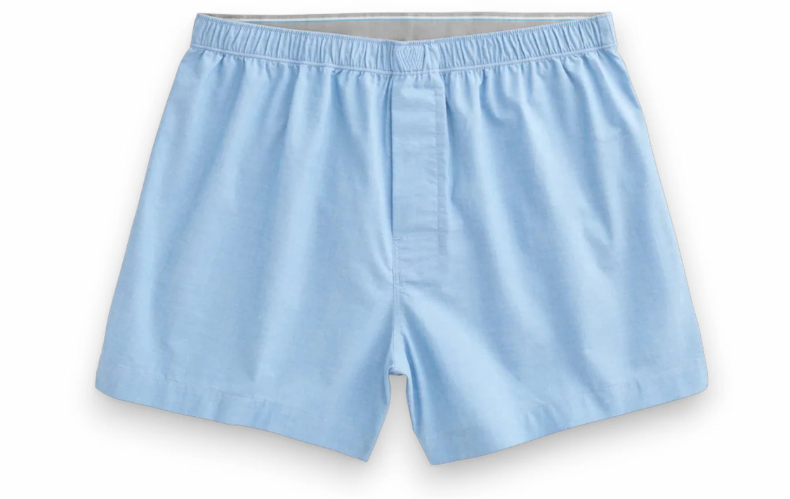 Light blue cotton boxer shorts with an elastic waistband and button fly. Fearrington Village.