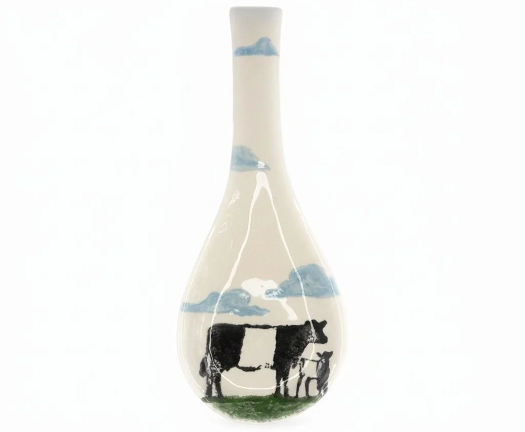Vietri's belted galloway spoon rest with clouds. Fearrington Village.