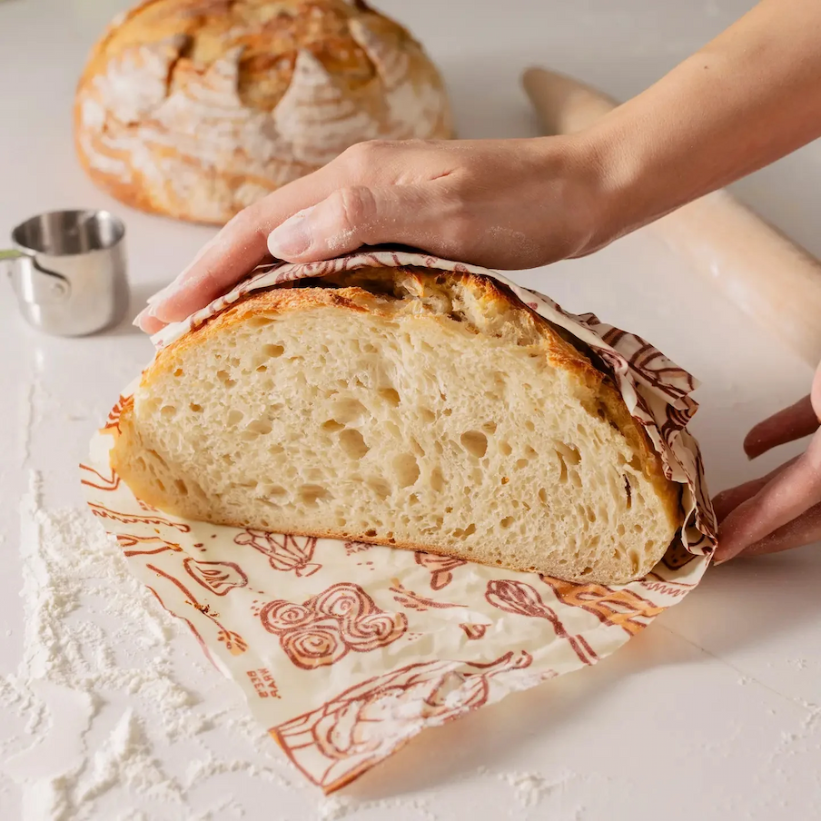 Freshly baked sourdough loaf wrapped in reusable beeswax bread wrap. Fearrington Village.