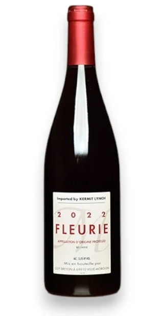 Bottle of 2022 Fleurie red wine with a cream label and red capsule. Fearrington Village.
