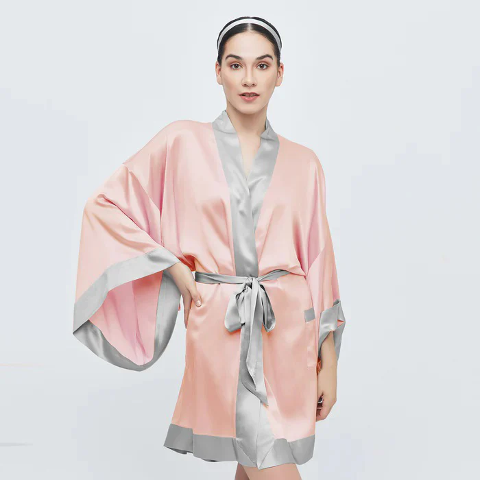Woman wearing a blush satin spa robe with silver trim at Fearrington Village.