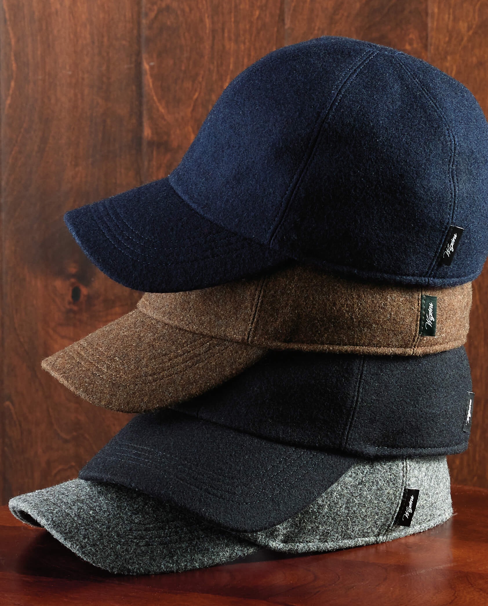Stack of wool baseball caps in navy, brown, black and gray. Fearrington Village.