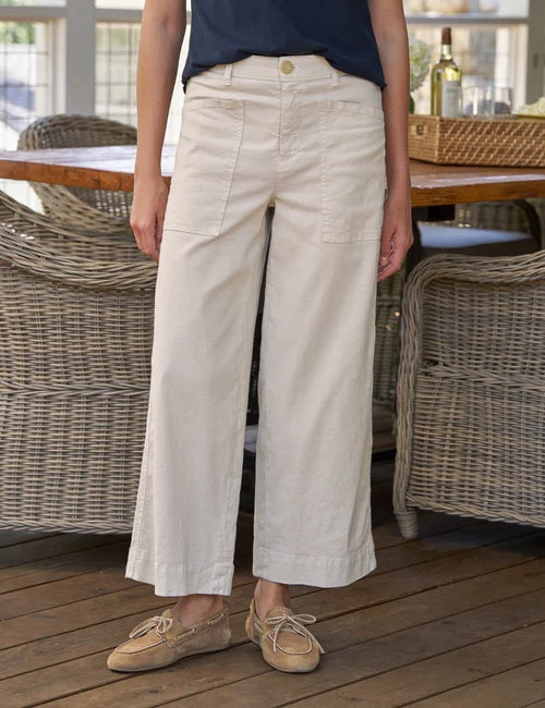 Cream cropped wide-leg pants with front patch pockets styled with beige loafers. Fearrington Village.