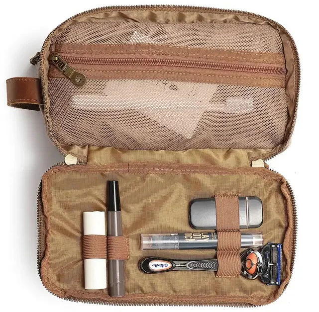 Open toiletry bag with organized travel grooming essentials. Fearrington Village.