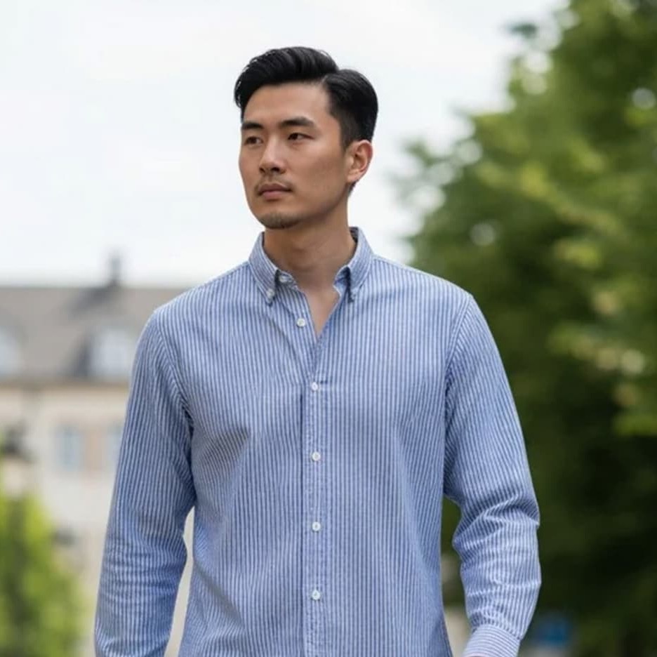 Man wearing a blue striped button-down shirt outdoors. Fearrington Village.