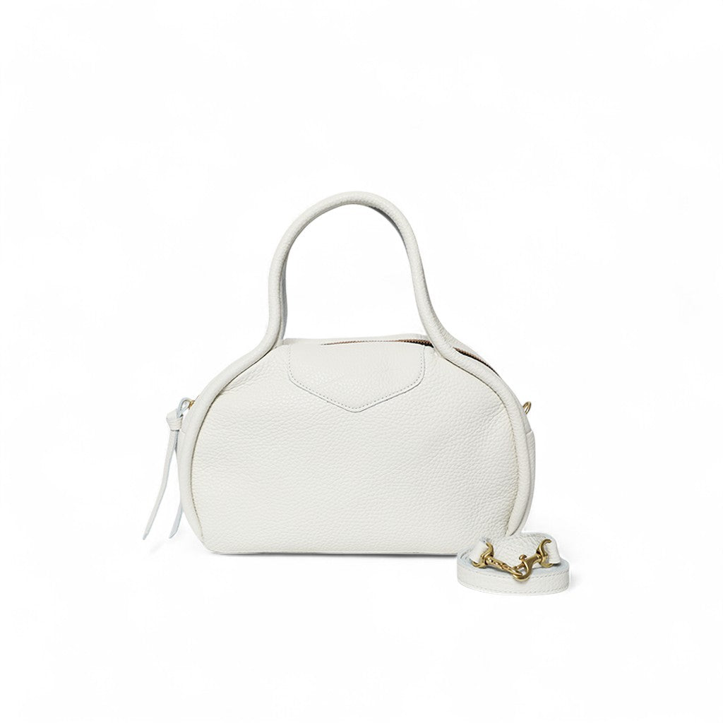 Structured ivory leather handbag with a softly rounded silhouette, top handle, and subtle pebbled texture, accented by a detachable strap with gold hardware and a clean, minimal front panel.