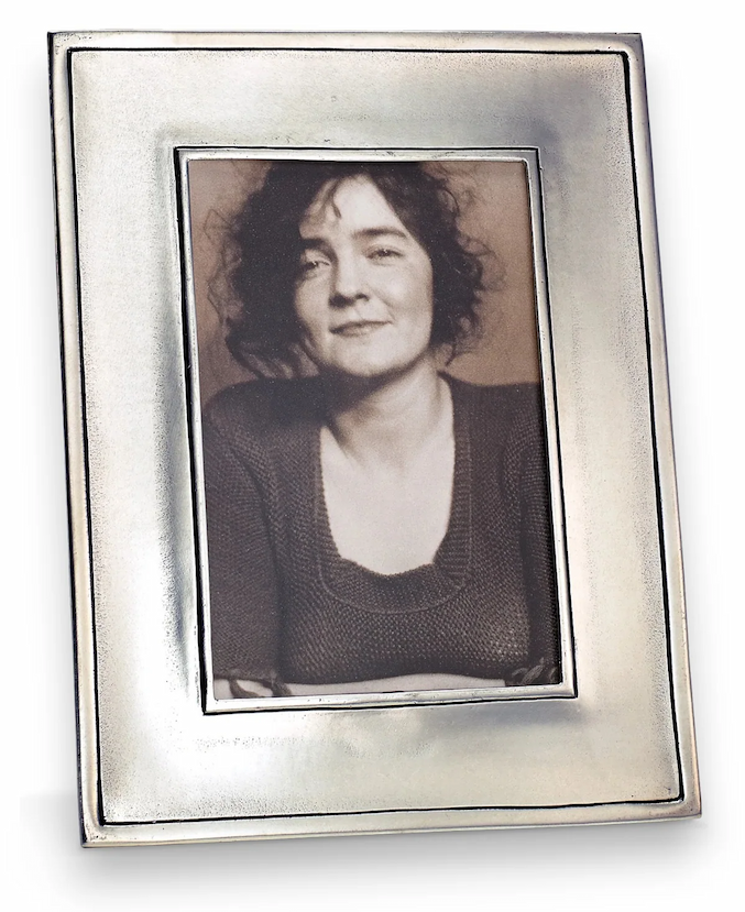 Rectangular pewter picture frame with a softly brushed finish, displaying a black-and-white portrait of a woman, photographed against a clean white background.