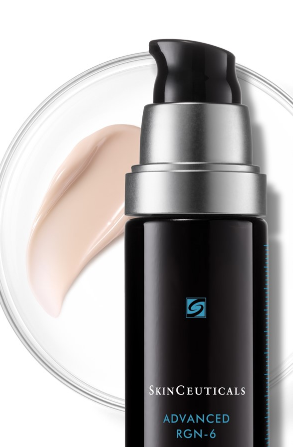 Close-up of a SkinCeuticals Advanced RGN-6 serum bottle with a pump, shown against a light background with a swipe of cream on a glass dish behind it.