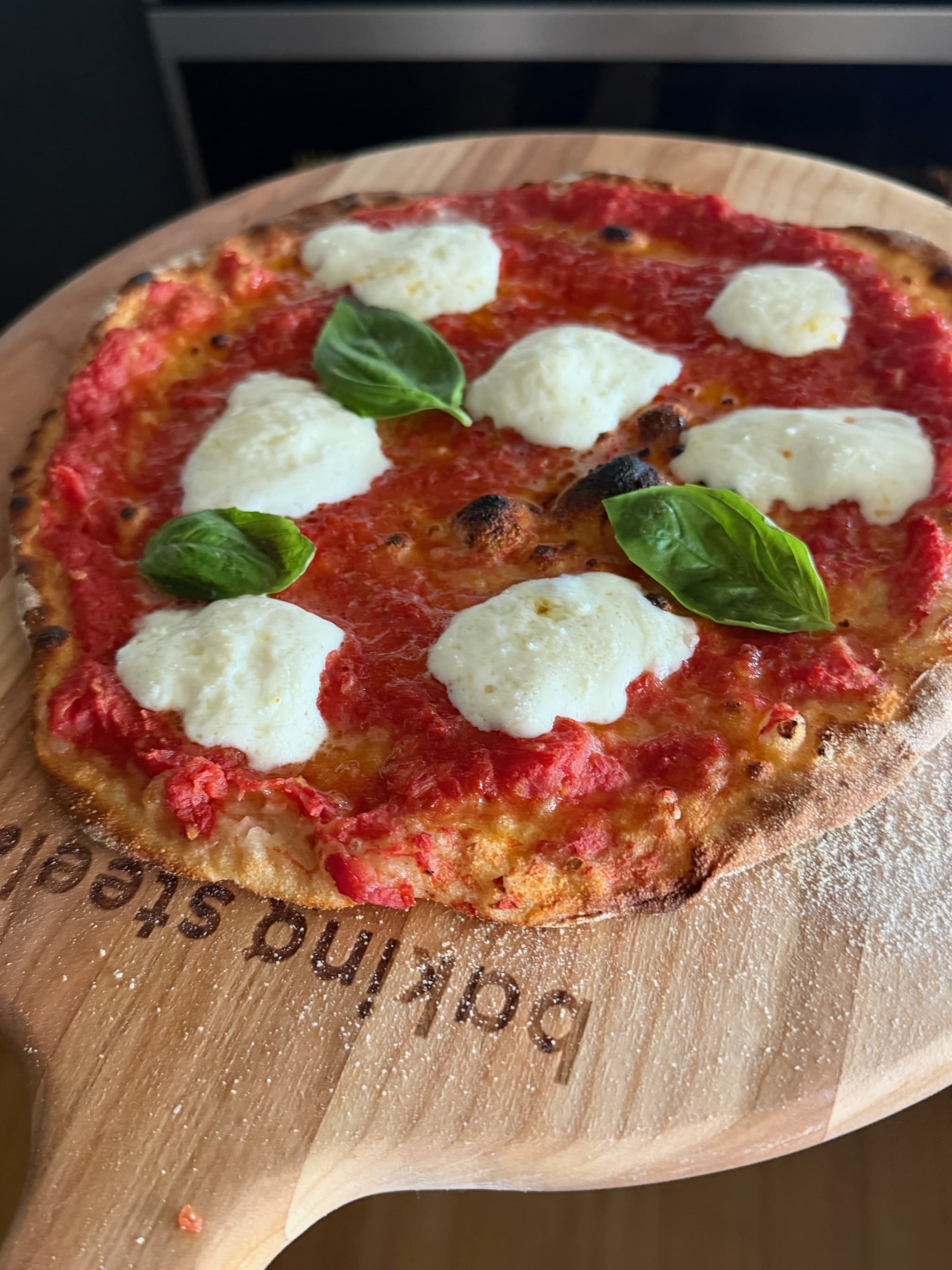 72 hour pizza dough on a wooden pizza peel