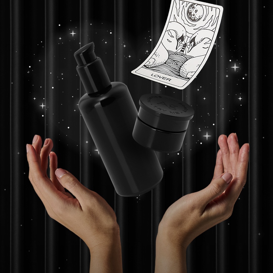 ARgENTUM's la lotion infinie & la potion infinie 14ml floating above a pair of hands with the LOVER archetype card