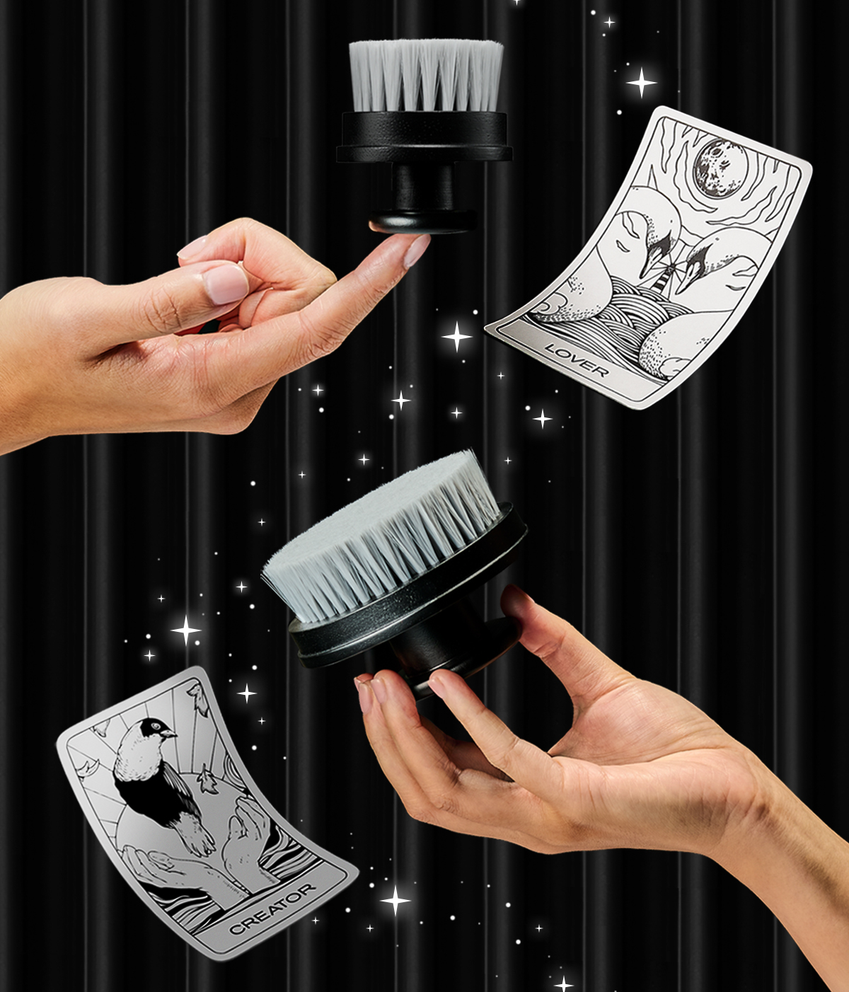 ARgENTUM's la lune d'argent and le feu d'argent (face and body brush) being held by a model's hands on a black background with the LOVER archetype card
