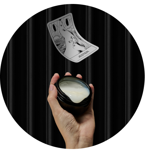 ARgENTUM's la lune de velours dripping out of the jar with the JESTER archetype card above