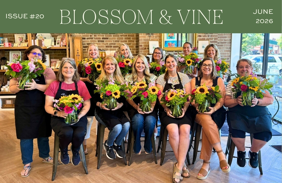 June 2026 Blossom & Vine newsletter cover featuring floral class participants holding colorful summer flower arrangements