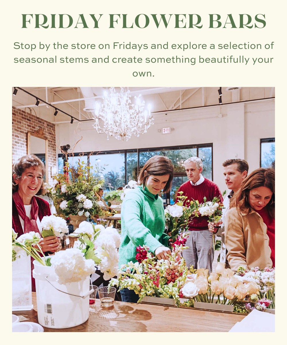 Customers creating personalized bouquets at a Blossom & Vine Friday Flower Bar surrounded by fresh seasonal flowers