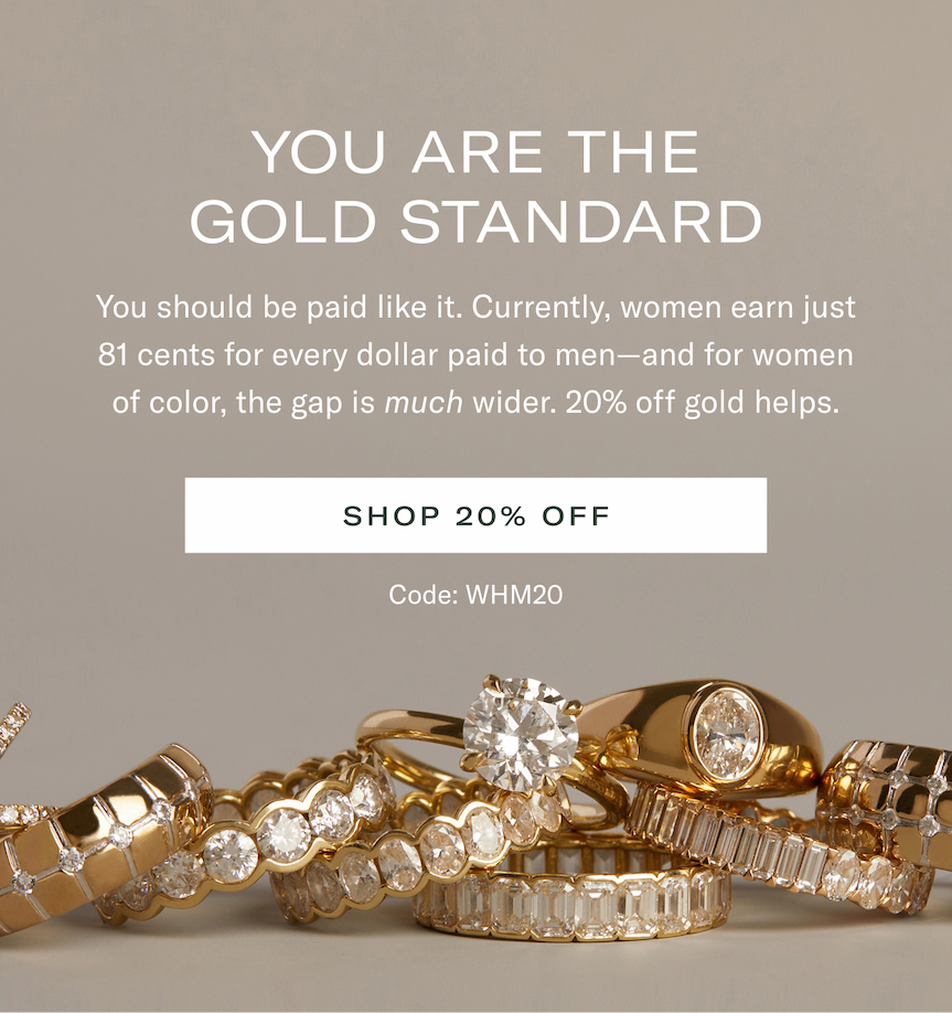 an image of a stack of gold and diamond rings with a diamond ring on top