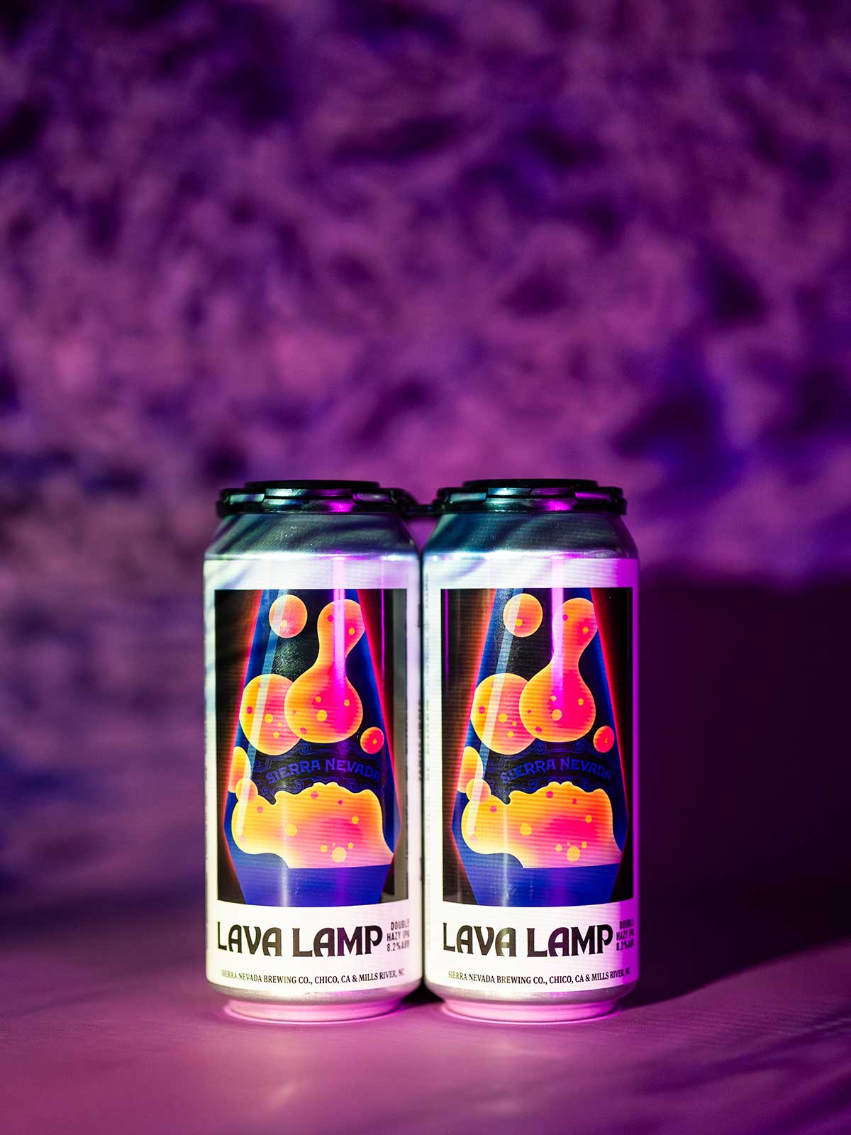 A 4-pack of Lava Lamp Double Hazy IPA against a trippy background