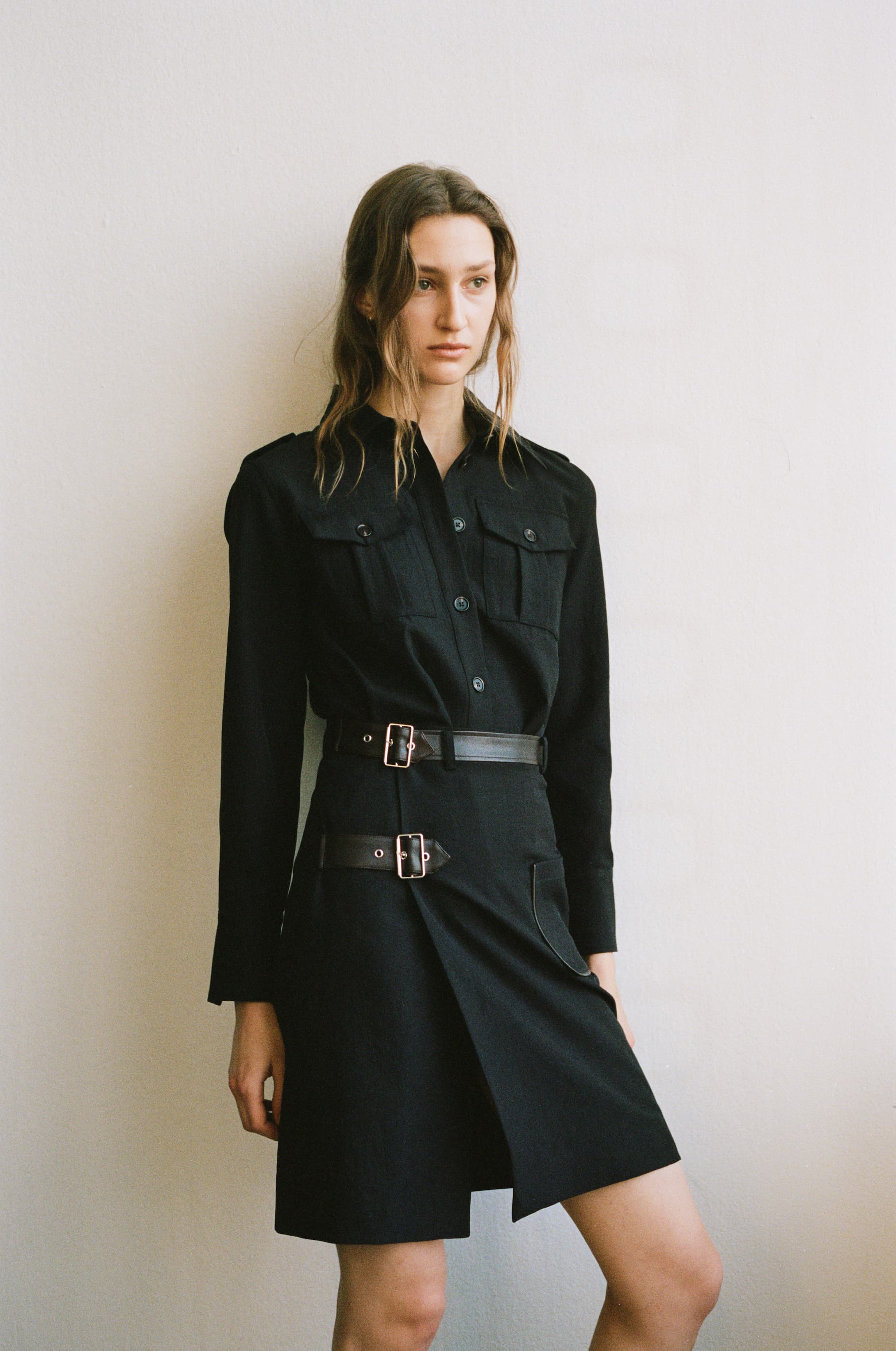 Model in checked skirt and shirt