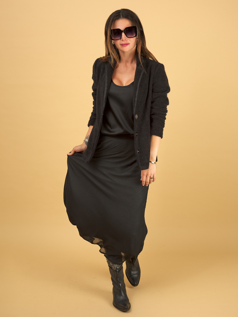 woman wearing the black slay skirt, decuir silk shell and austin blazer by inlarkin