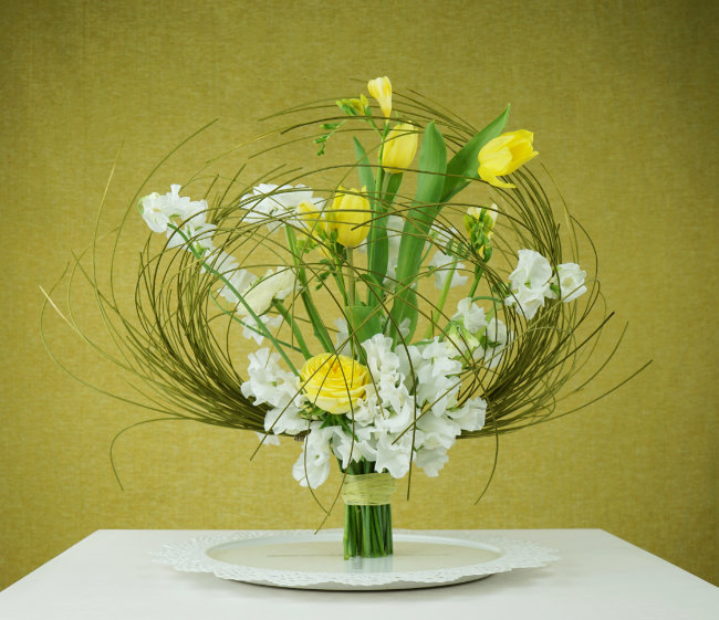 Hand tied bouquet standing in shallow water on wire feet - by Mark Pampling