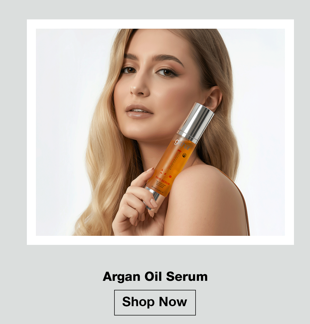 Woman holding GK Hair Argan Oil Serum