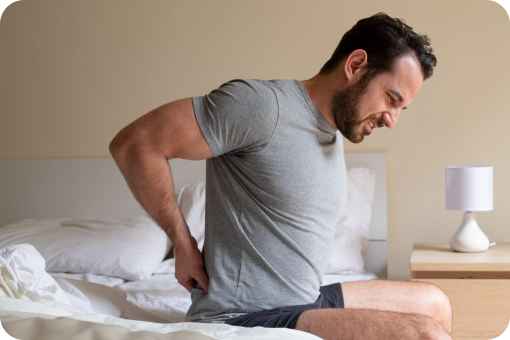 Man waking up with back pain