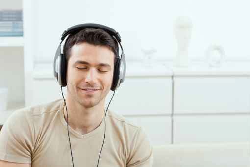 Person with headphones on and their eyes closed