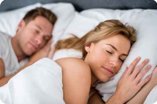 A man and women sleeping