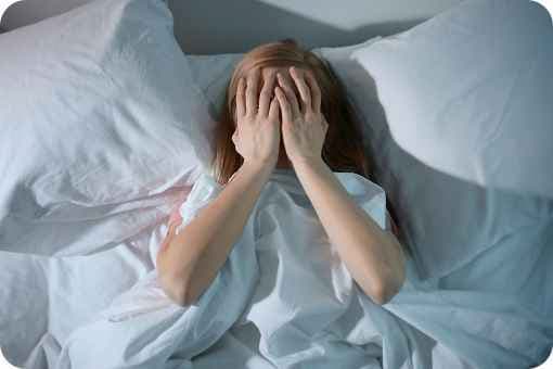 Person stressed in bed