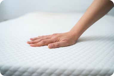 Hand on a mattress