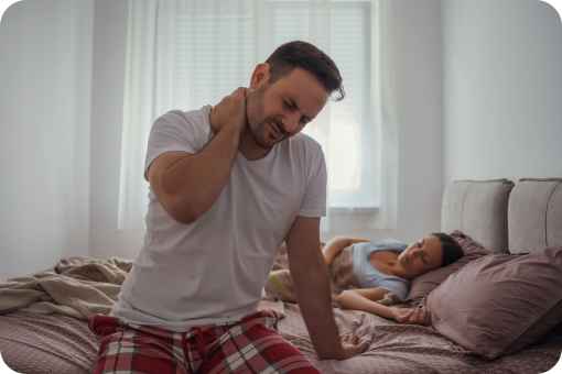 Man waking up with neck pain