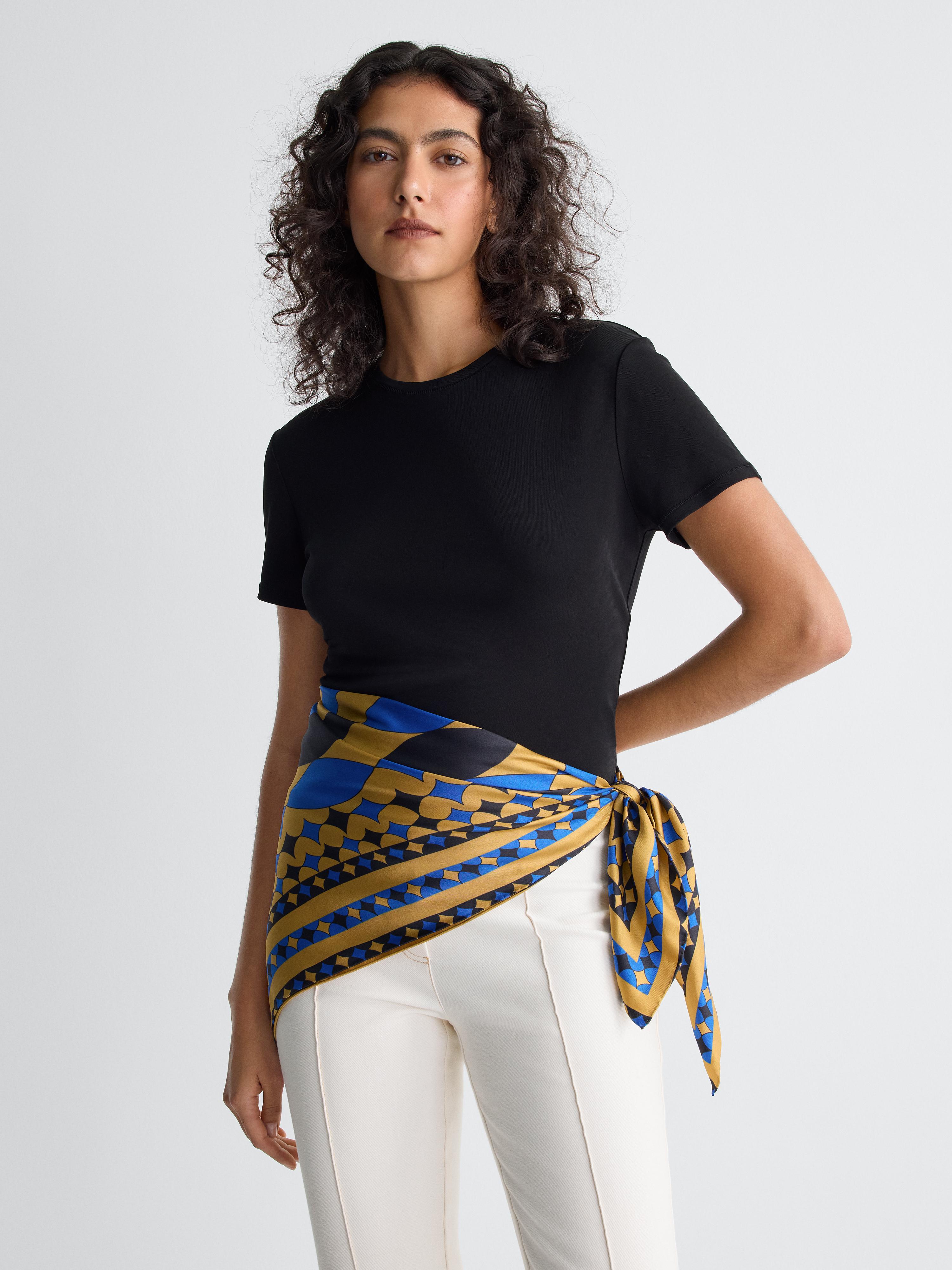 blue black and yellow scarf worn around waist on model