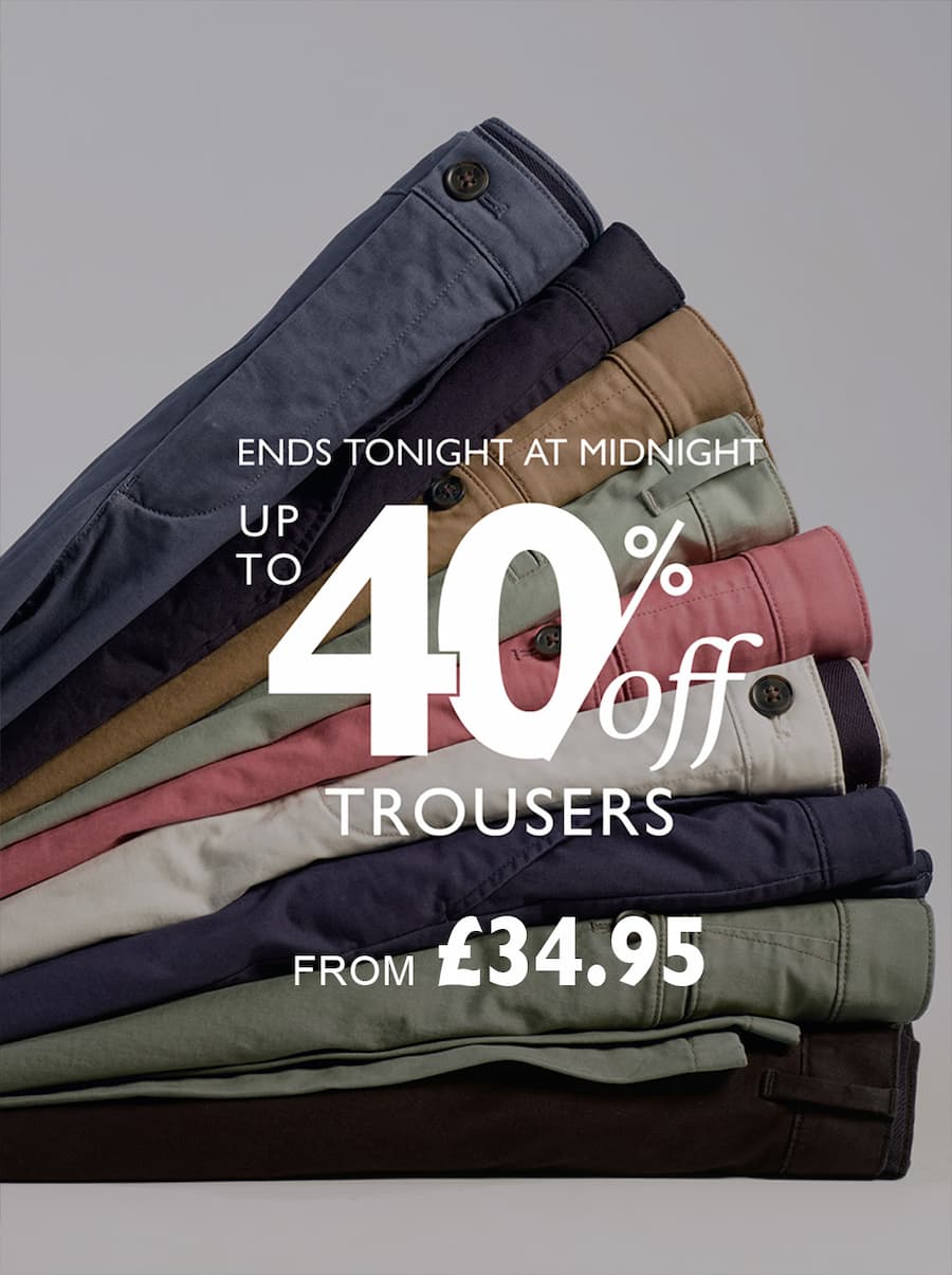 an image of a pile of men's pants with the words 40 % off