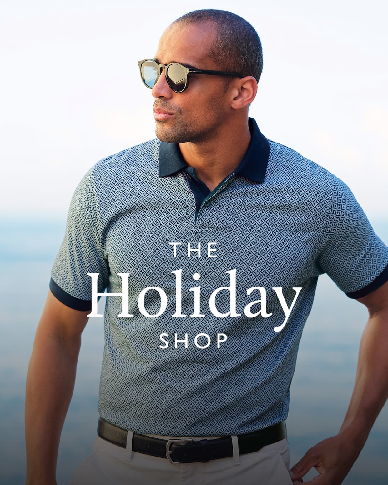 an image of a man sitting in a chair with a lake in the background