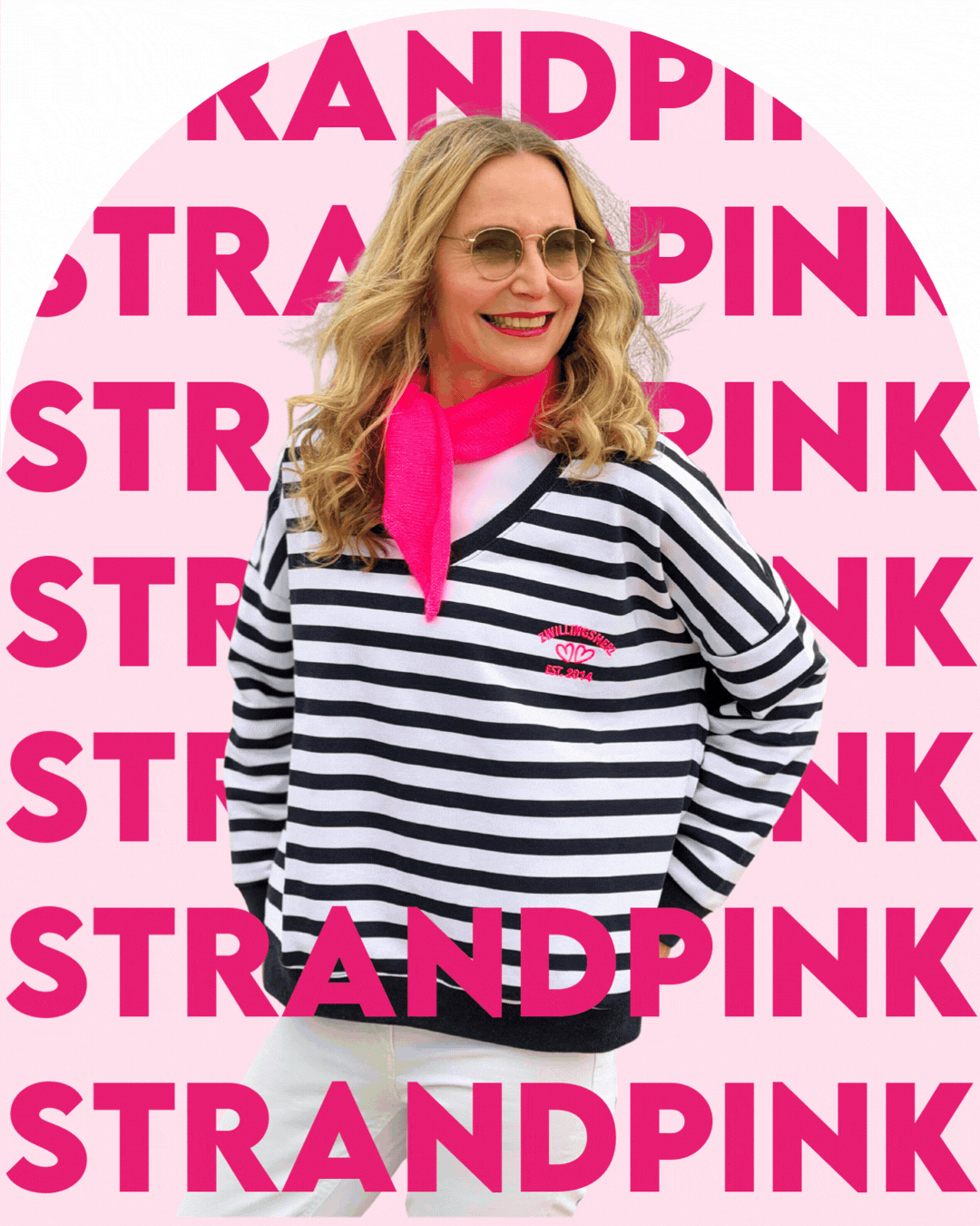 an image of two women in pink shirts and jeans posing for a picture