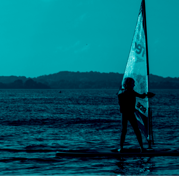 Kid windsurfing using a 9'4" 3-in-1 Snapper paddleboard