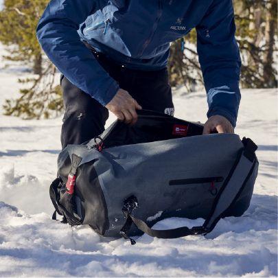 Woman carrying waterproof Kit Bag