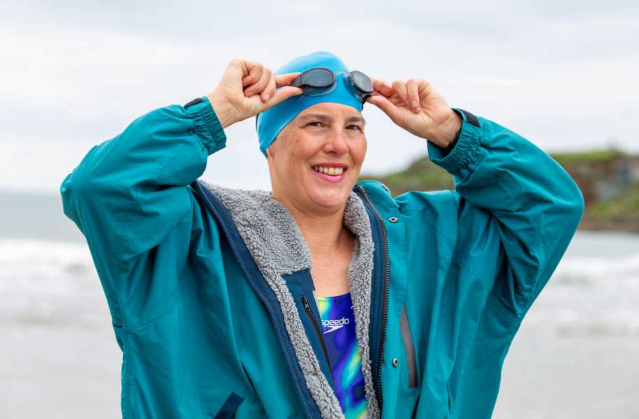 Female swimmer wearing Red Pro Change Robe EVO in Teal