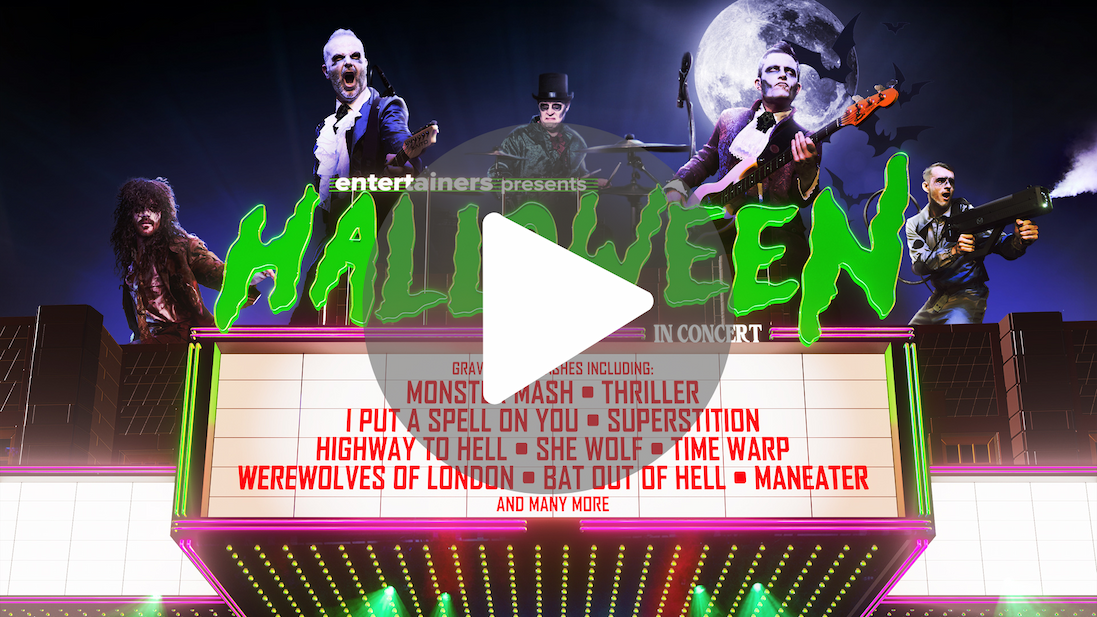 Promotional poster for Halloween in Concert featuring costumed rock musicians, spooky moonlit imagery and a marquee listing Halloween-themed songs including Thriller and Monster Mash.