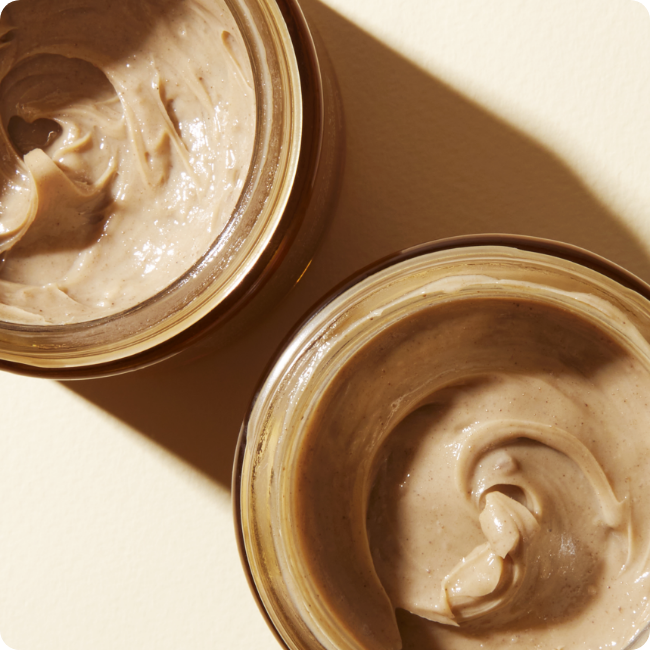 Open jars of Oju Omi Mud Cleanser