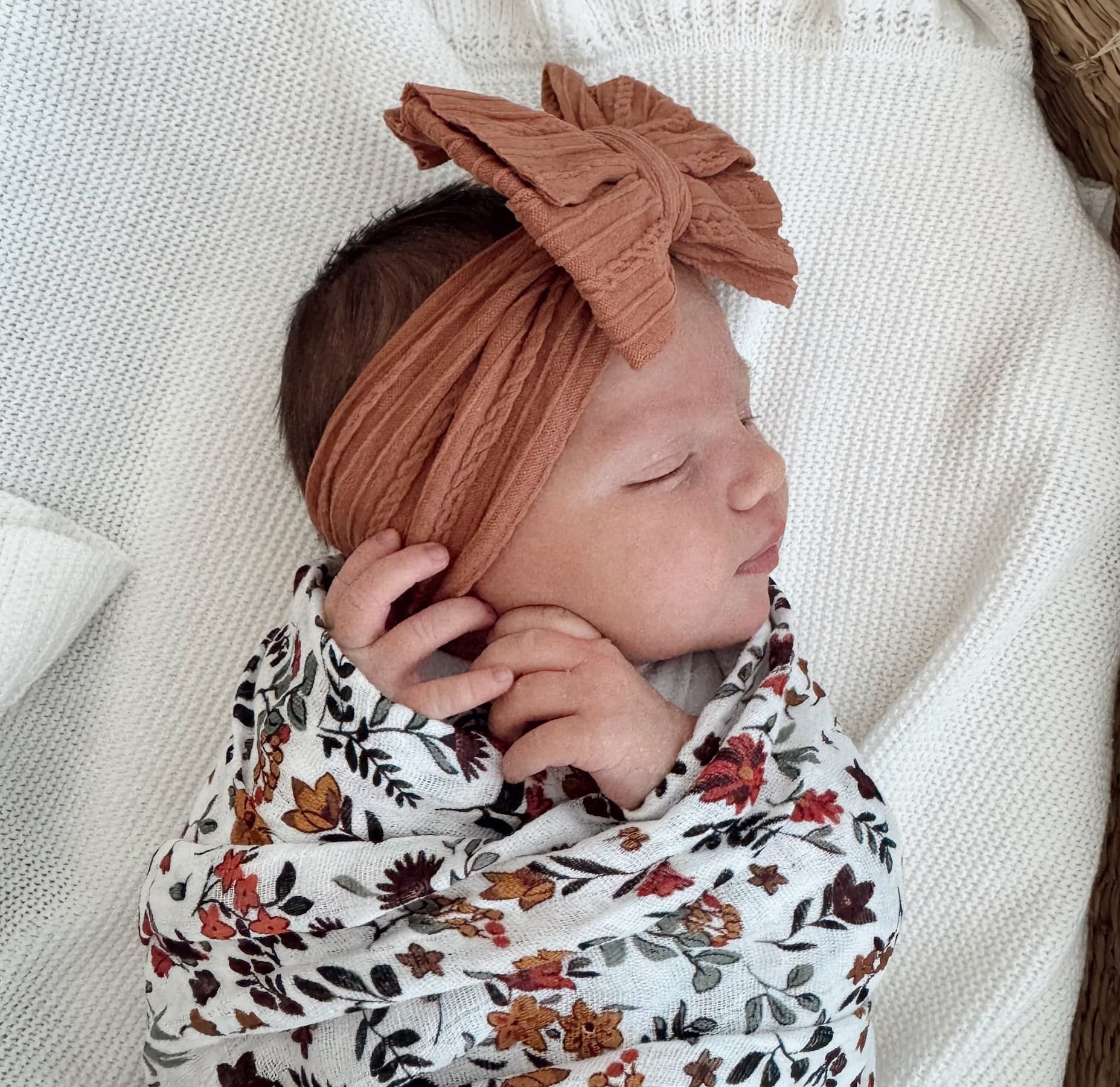 Cute Baby Swaddled and Wearing a Bow