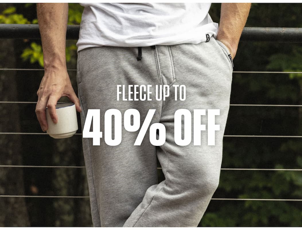 Fleece up to 40% off promo showing gray sweatpants and a hand holding a mug.
