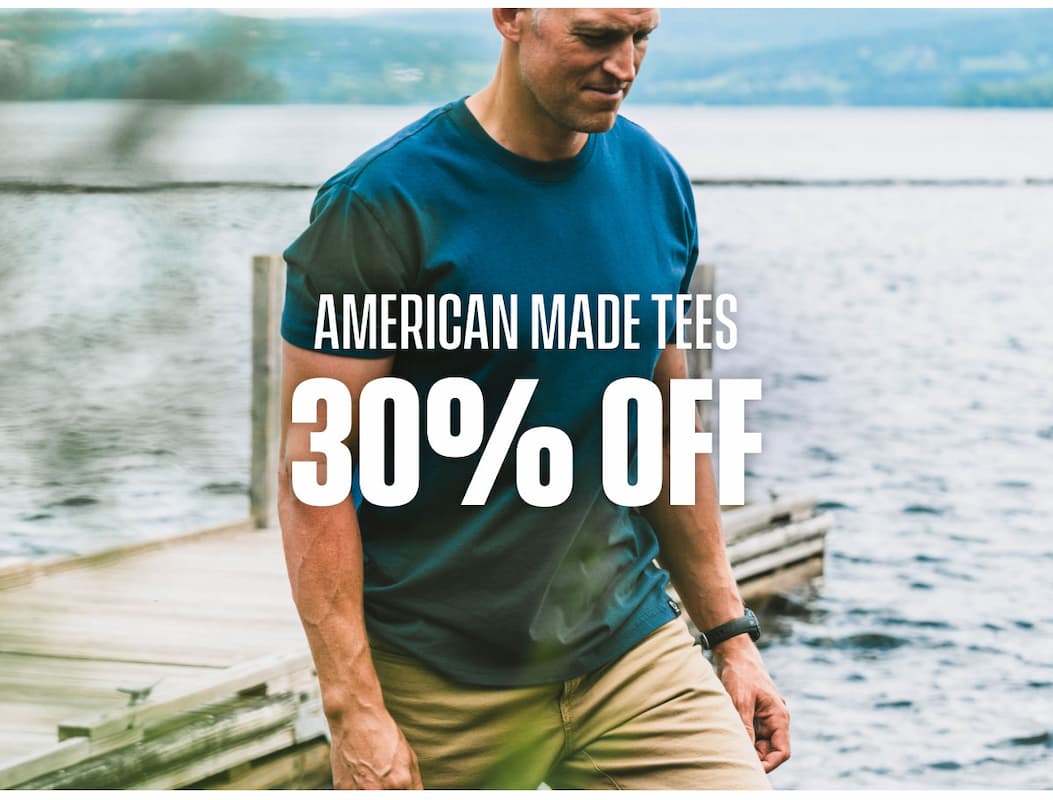 American Made Tees 30% off promo showing a man in a blue tee near the water.